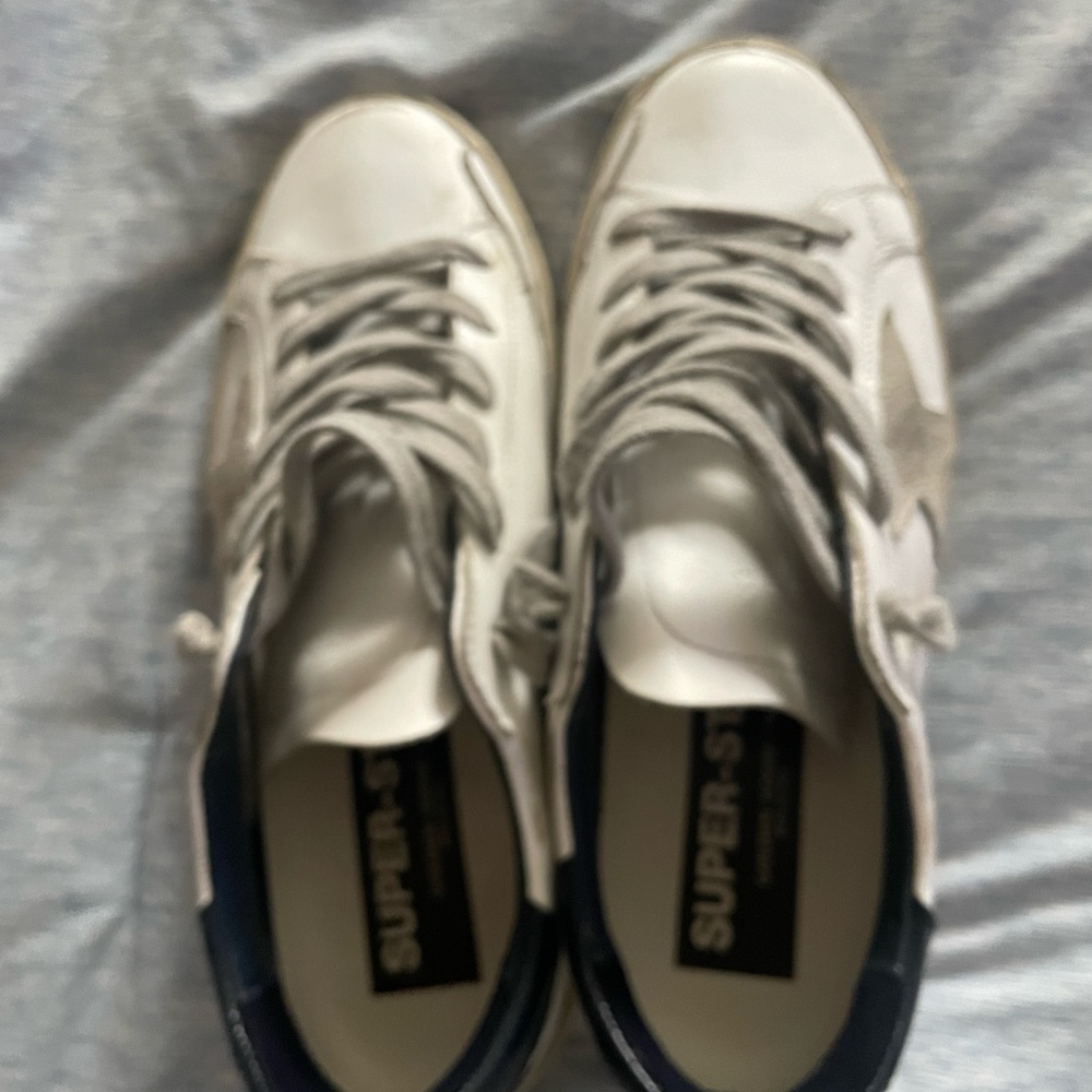 Golden Goose size 8. Wore for an hour and they were kind of small. Perfect